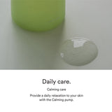 Close-up of Abib Heartleaf Essence gel texture beside the calming pump bottle.