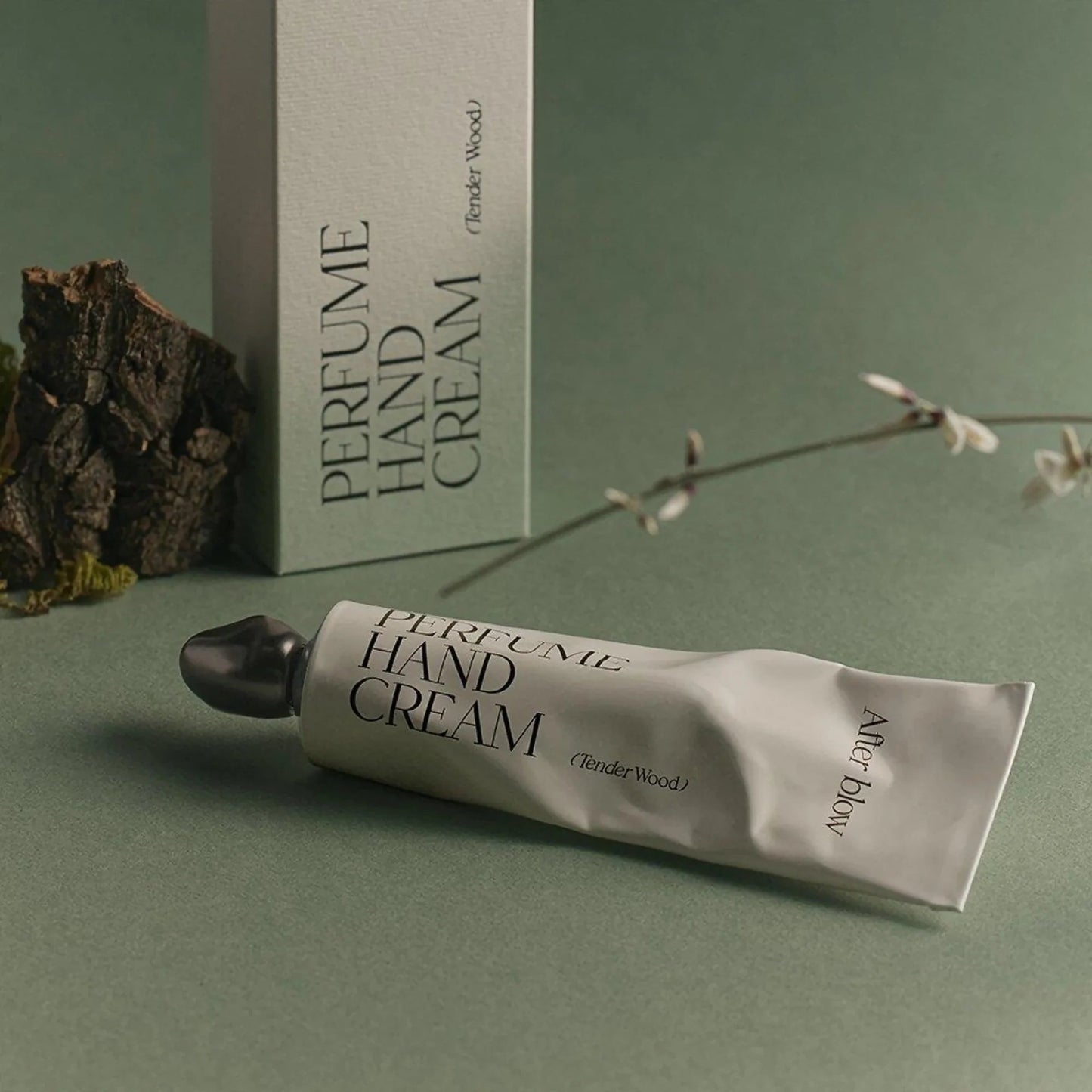 Afterblow Tender Wood perfume hand cream with forest inspired packaging.