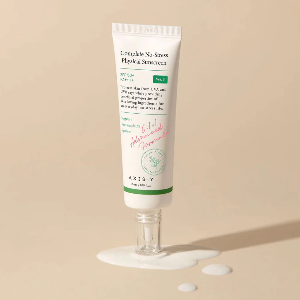 Axis-Y Complete No-Stress Physical Sunscreen SPF 50+ tube standing upright with cream puddle.