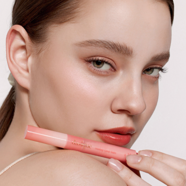 Model wearing Dasique Candy Balm 08 Sweet Pomelo with natural makeup look.
