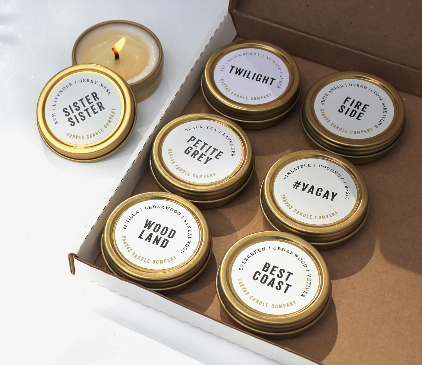 Canvas Candle mini tin gift set with 8 scents including Vacay, Petite Grey, and Woodland.