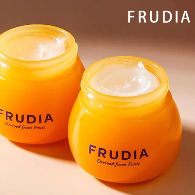 Open jars of Frudia Blueberry Hydrating Honey Lip Balm showing creamy texture.