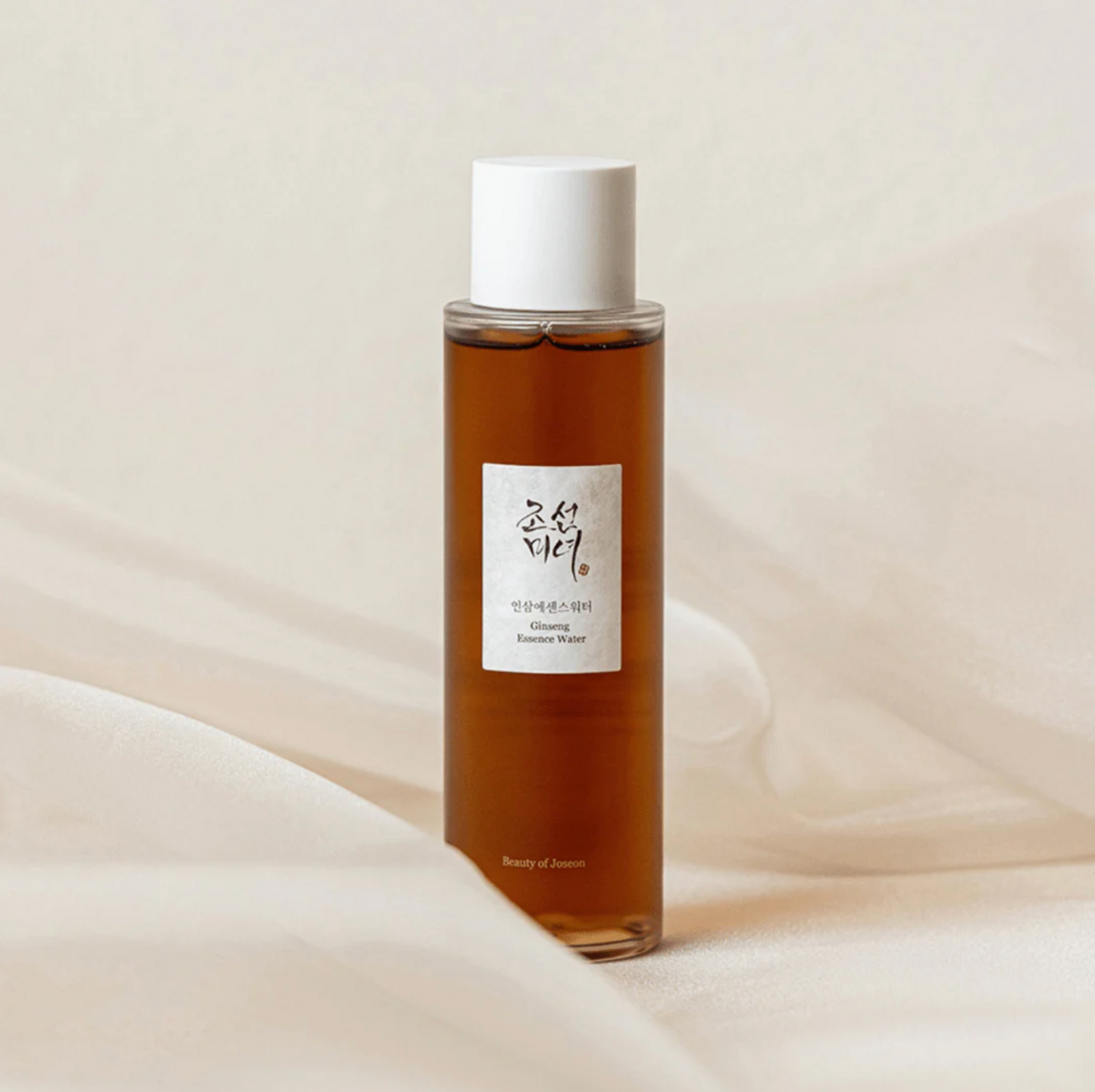 Beauty of Joseon Ginseng Essence Water bottle standing on soft fabric, minimal product image.