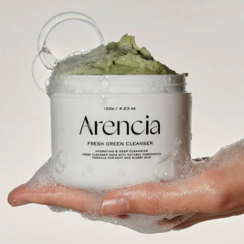 Arencia Fresh Green Cleanser in foamy texture with bubbles on hand.