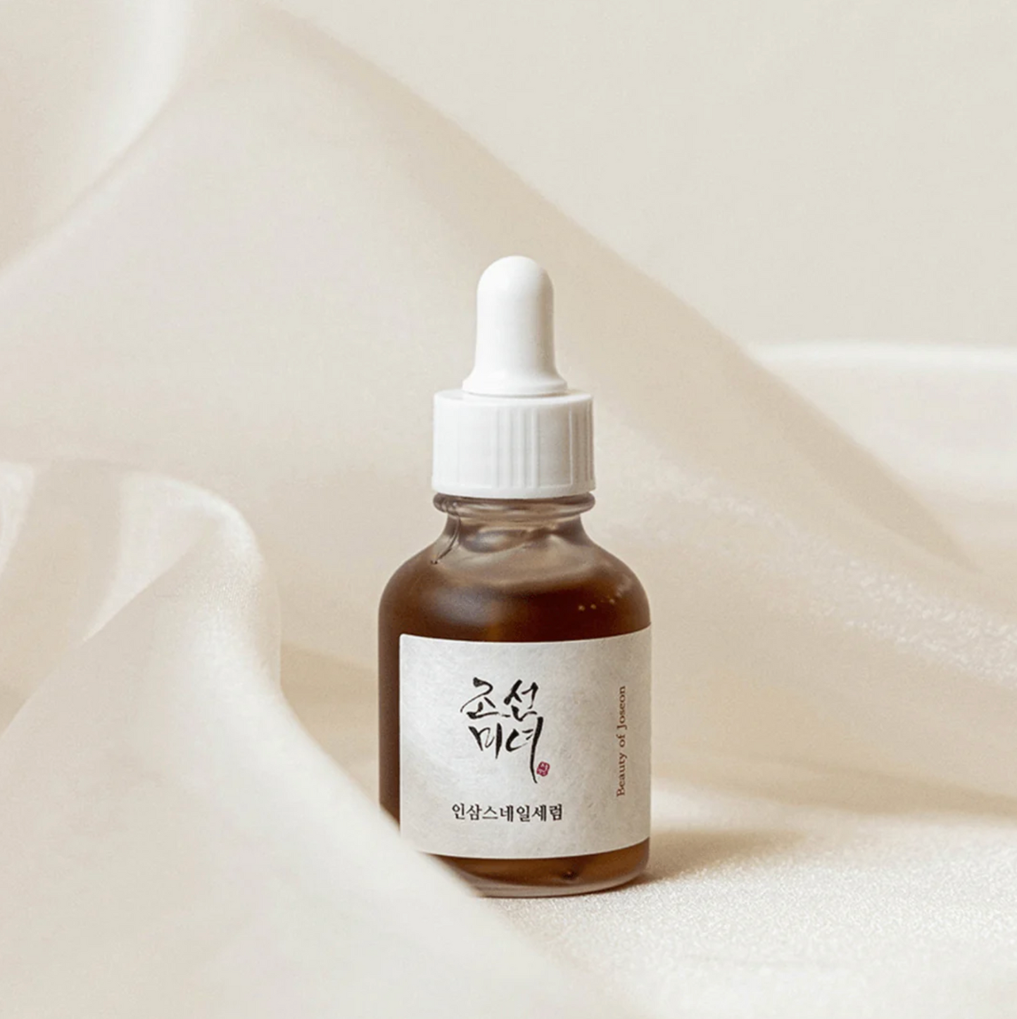 Beauty of Joseon Revive Serum with Ginseng and Snail Mucin in minimalist product shot.