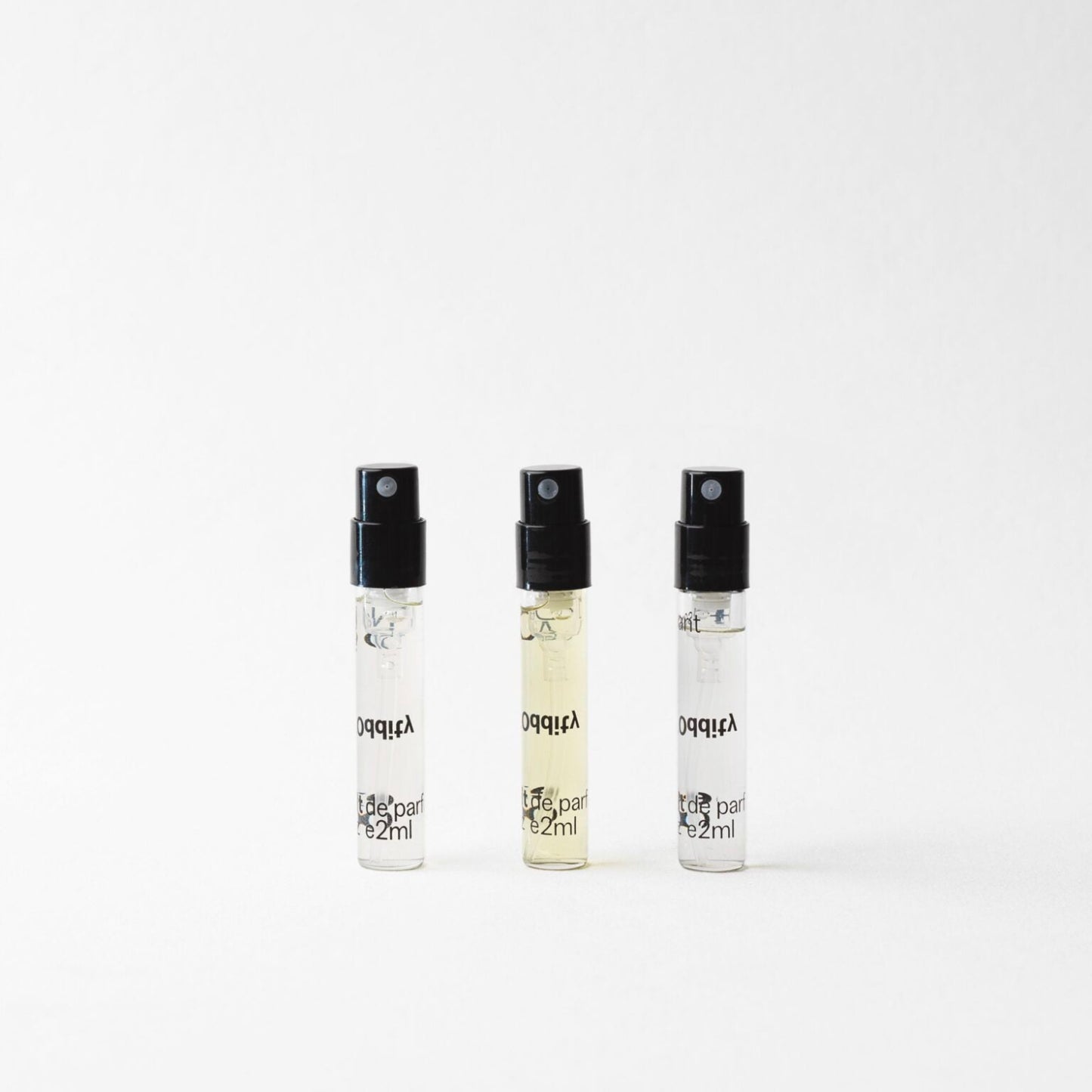 Oddity Discovery Set 2ml spray perfume samples in clear vials with black caps.