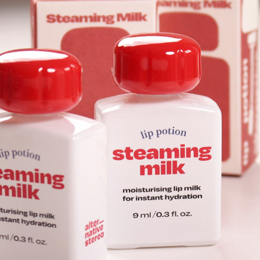 Alternative Stereo Steaming Milk Lip Potion – hydrating lip milk with red cap and boxed packaging.