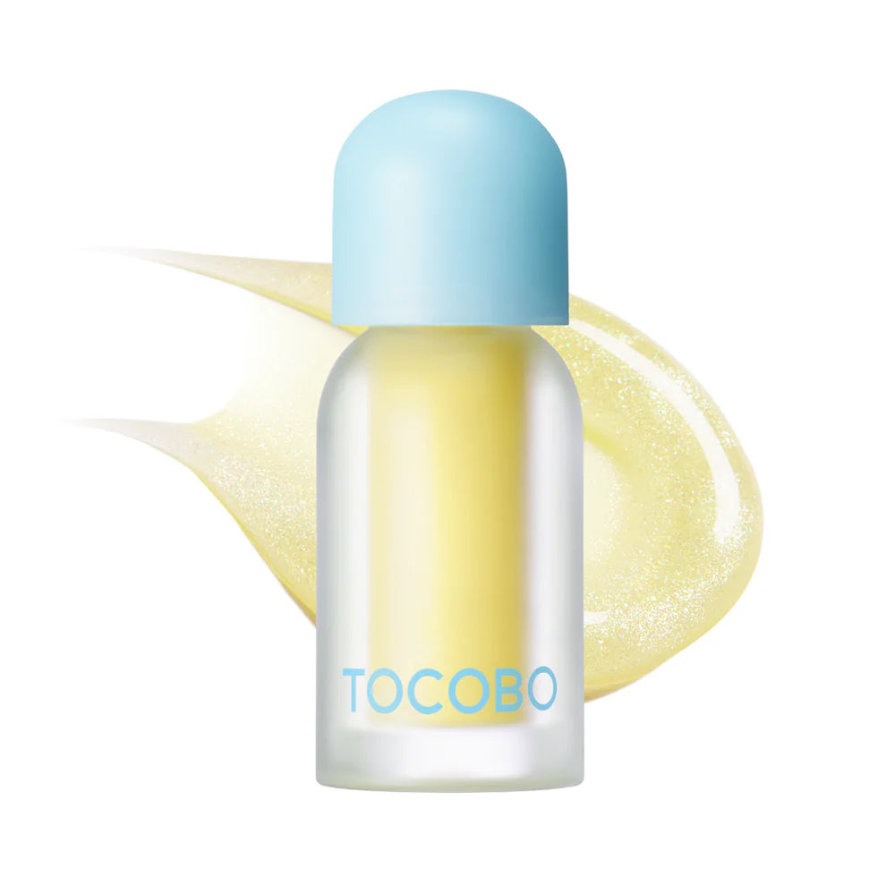 Yellow TOCOBO lip oil bottle with shimmering swatch.