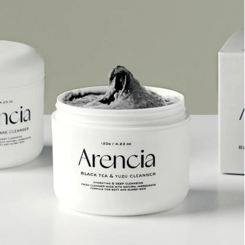 Arencia Black Tea & Yuzu Cleanser jar with product texture swirled on top.