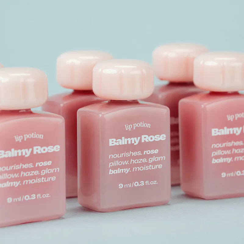 Group shot of Alternative Stereo Balmy Rose – multiple bottles in rosy pink hydrating formula
