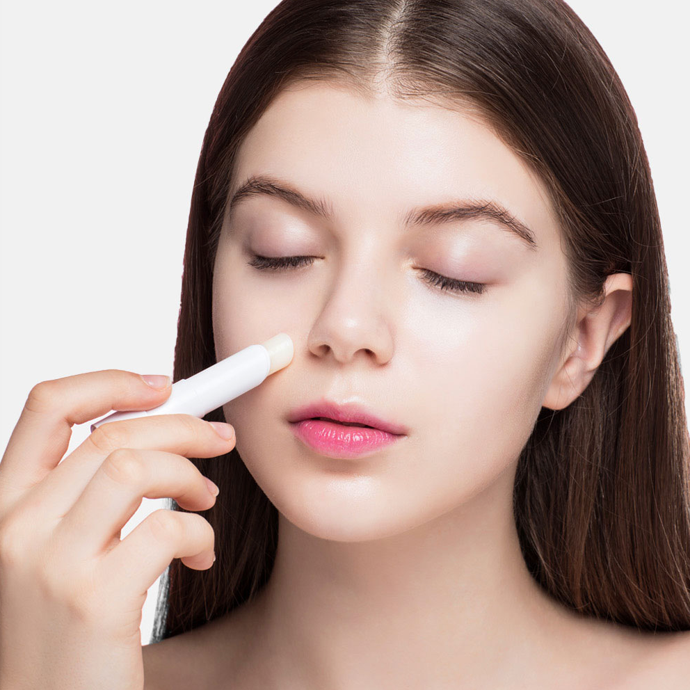 Model applying Collagen Multi Stick Balm for moisture and firming care.