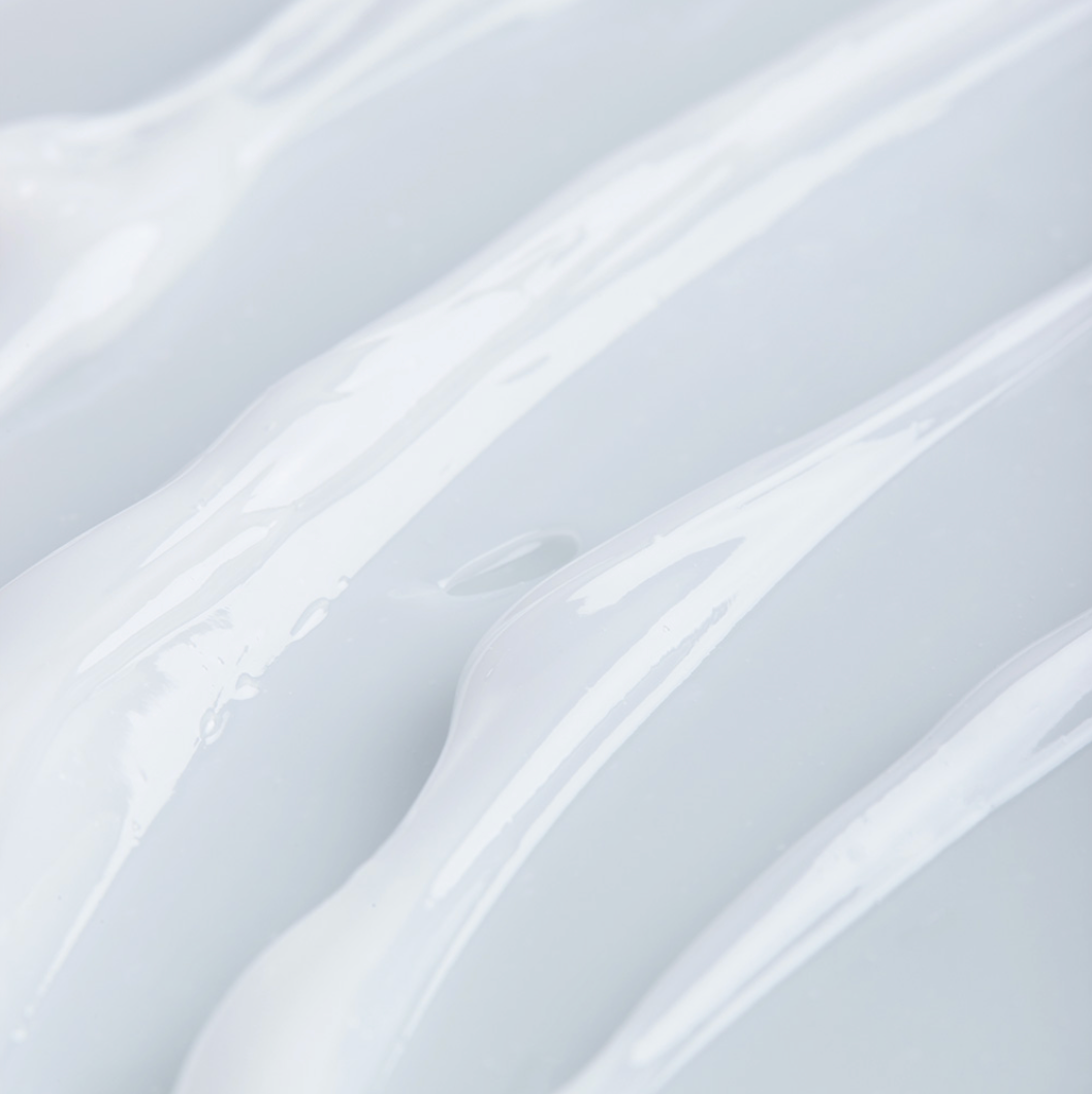 Smooth close-up of the Dermafix Cica-Collagen S.O.S Cream’s gel-like texture, emphasizing hydration.
