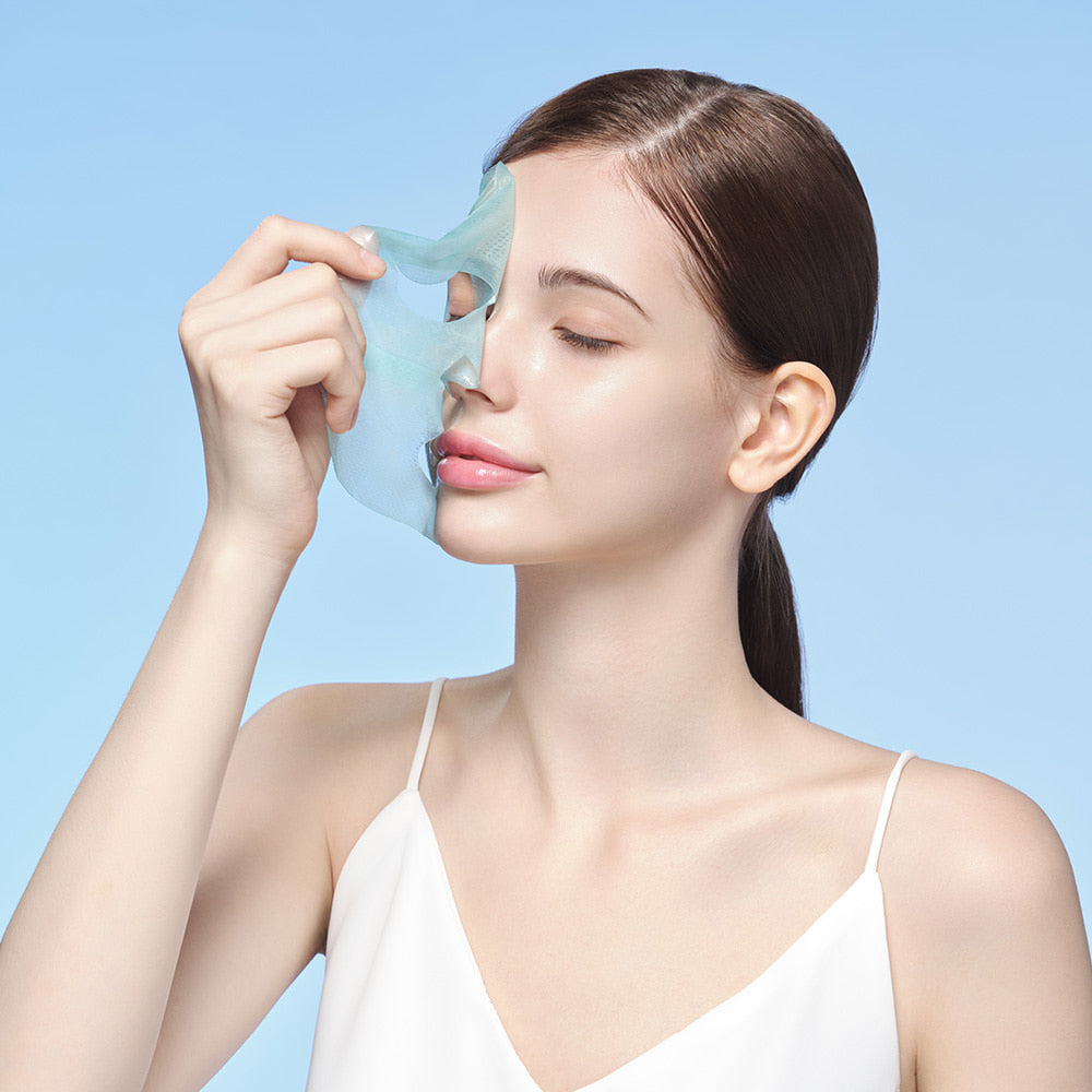 Model applying Dermafix HYAL Collagen Mask to face, demonstrating hydration and soothing effect.