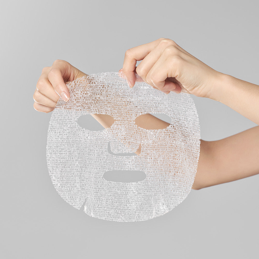 Transparent mesh sheet of Dermafix Slow Aging Mask held with both hands before use.
