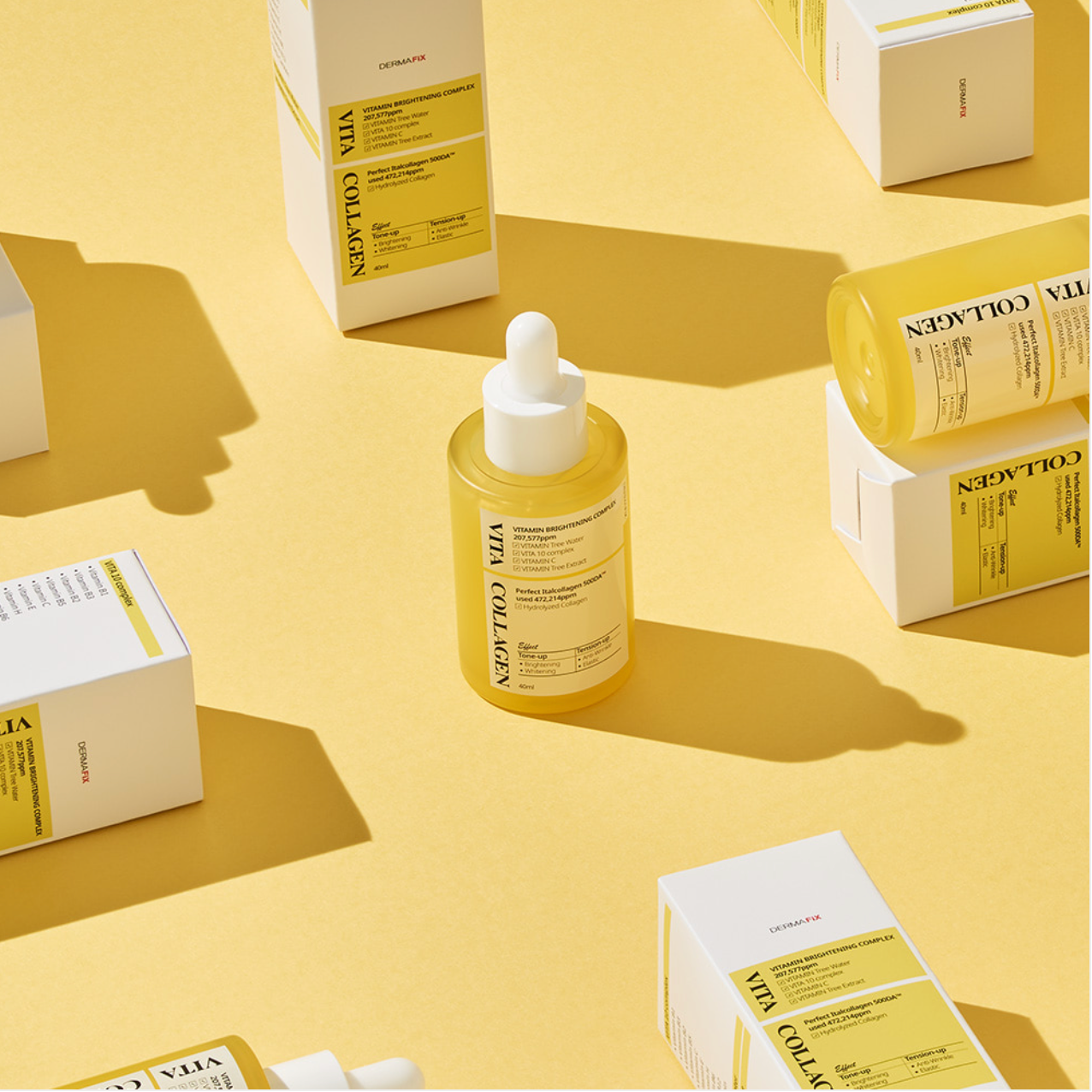 Dermafix Vita Collagen ampoule bottle and boxes arranged on yellow backdrop.
