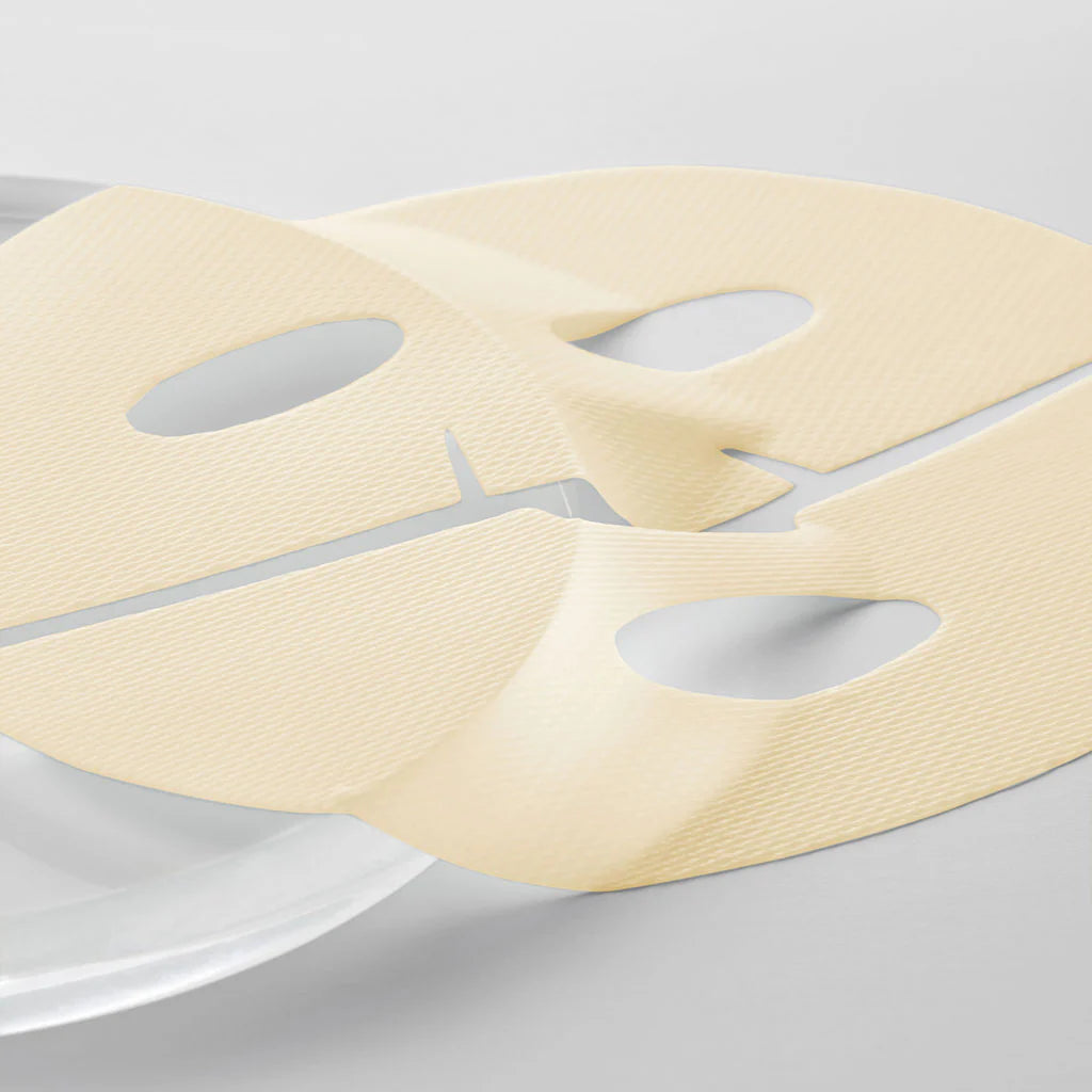 Dermafix VITA Collagen mask texture showing structured sheet material for skin adhesion and comfort.